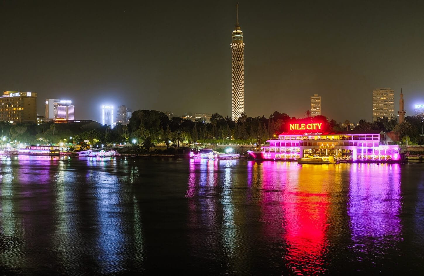 A picture of a river cruise restaurant with the Cairo Tower