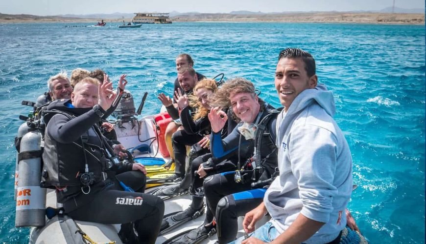 A great photo of a group of tourists on a diving trip from above the buoy in Marsa Alam