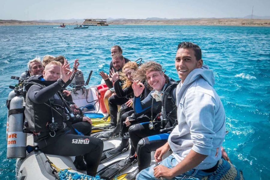 A great photo of a group of tourists on a diving trip from above the buoy in Marsa Alam