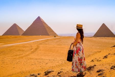 A woman visits the pyramids