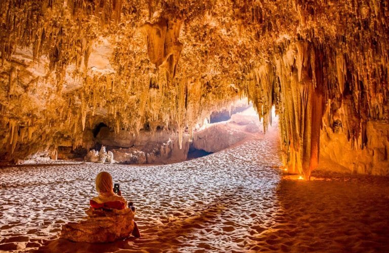 A wonderful photo of a girl from the inside of the Djara cave in the Bahariya oasis