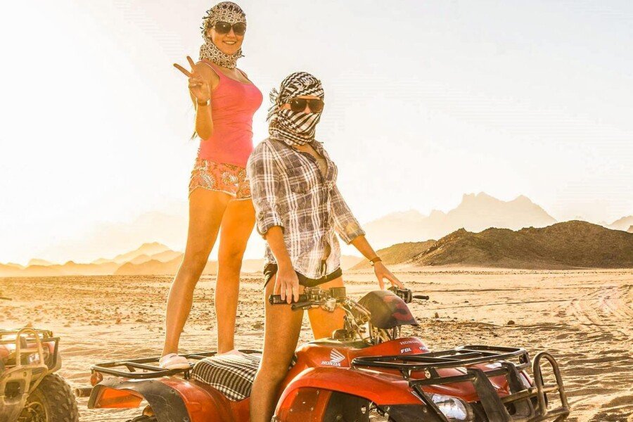 A wonderful shot of two people riding a quad bike from one of the safari trips