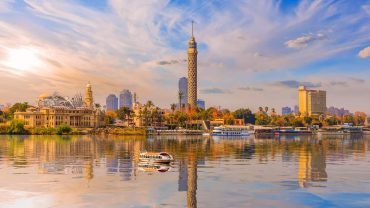 Cairo Tower with its reflection on the Nile River