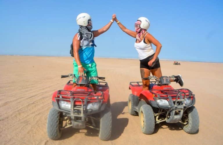 Great photo of a couple of tourists in Marsa Alam desert Quad bike