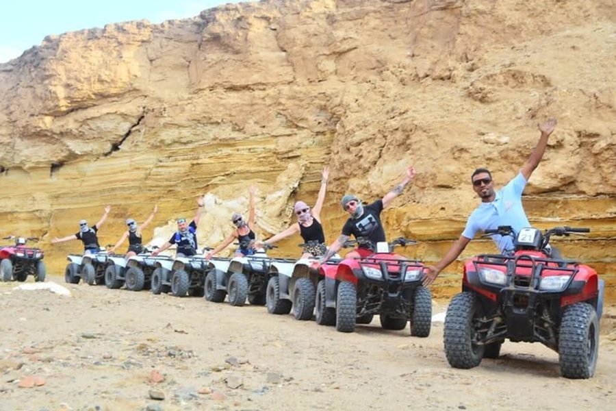 Great photo of a group of tourists in Marsa Alam desert Quad bike