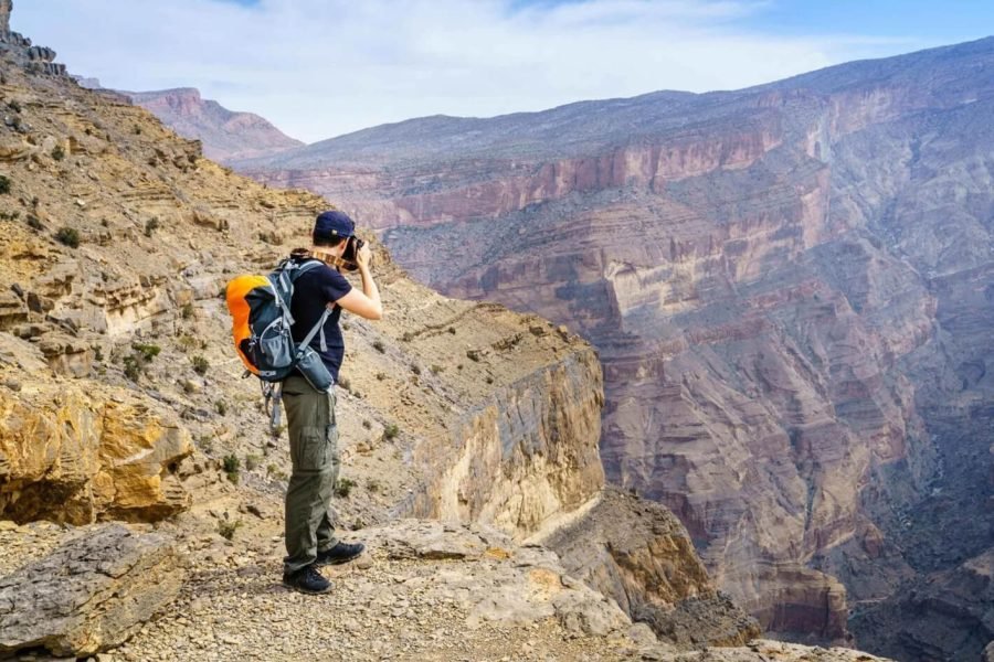 Great picture of tourists taking pictures of the most beautiful mountains in Oman