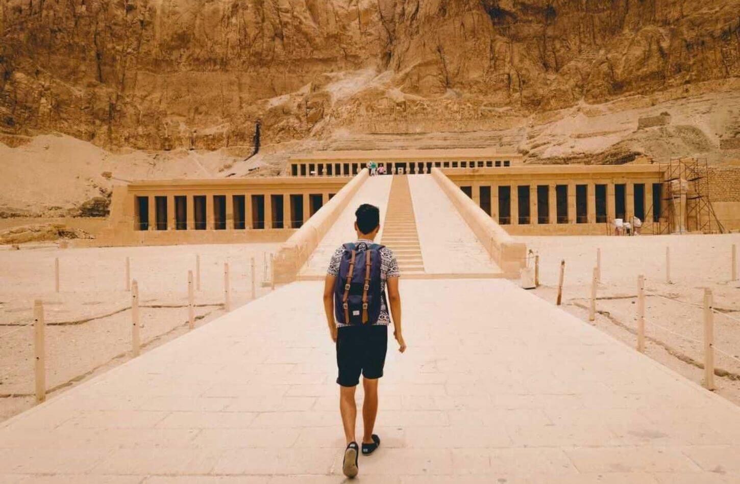 man walking toward hatshepsut temple luxor egypt