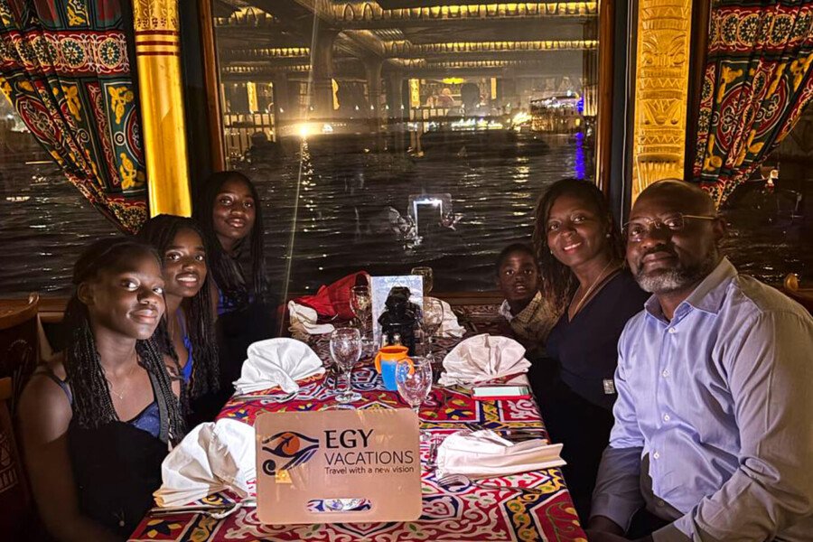 a wonderful photo of a family at a dinner party on the nile