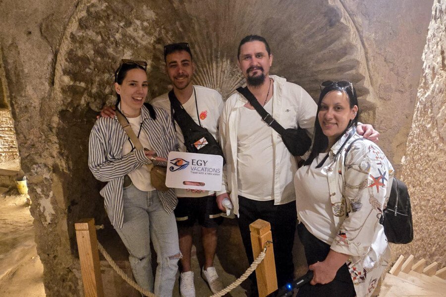 a wonderful photo of a group of tourists in kom el shoqafa in alexandria