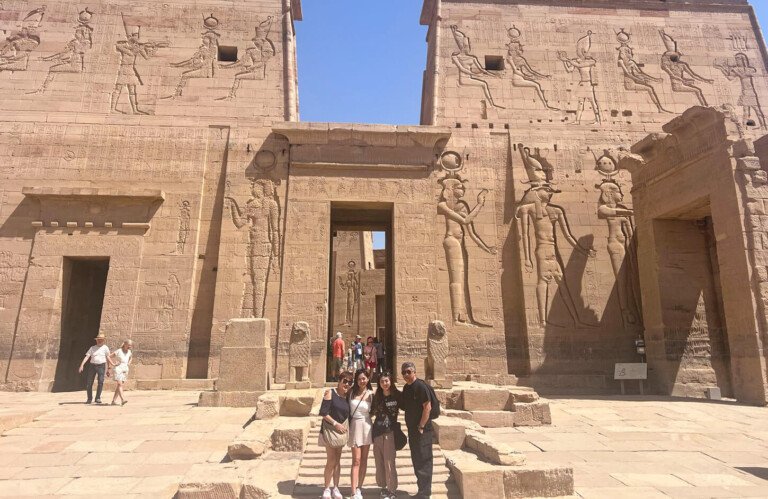 amazing shot of a group of tourists at edfu temple