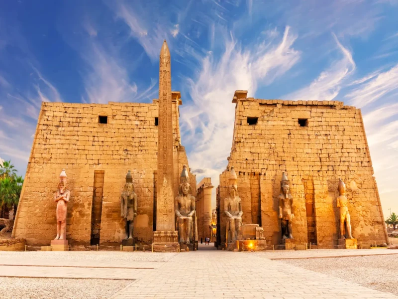 The Temple of Karnak in Egypt, featuring towering columns and detailed hieroglyphs, represents ancient Egyptian culture.
