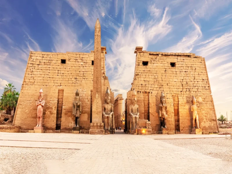The Temple of Karnak, a monumental site in Luxor, Egypt, featuring grand columns and intricate carvings in an open-air museum.
