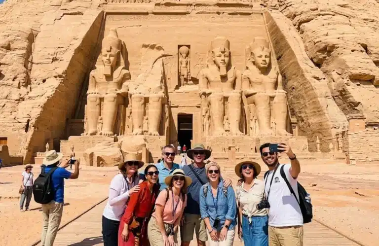 A stunning shot of a group of tourists in front of the Abu Simbel temple - Best Places to Visit in Egypt