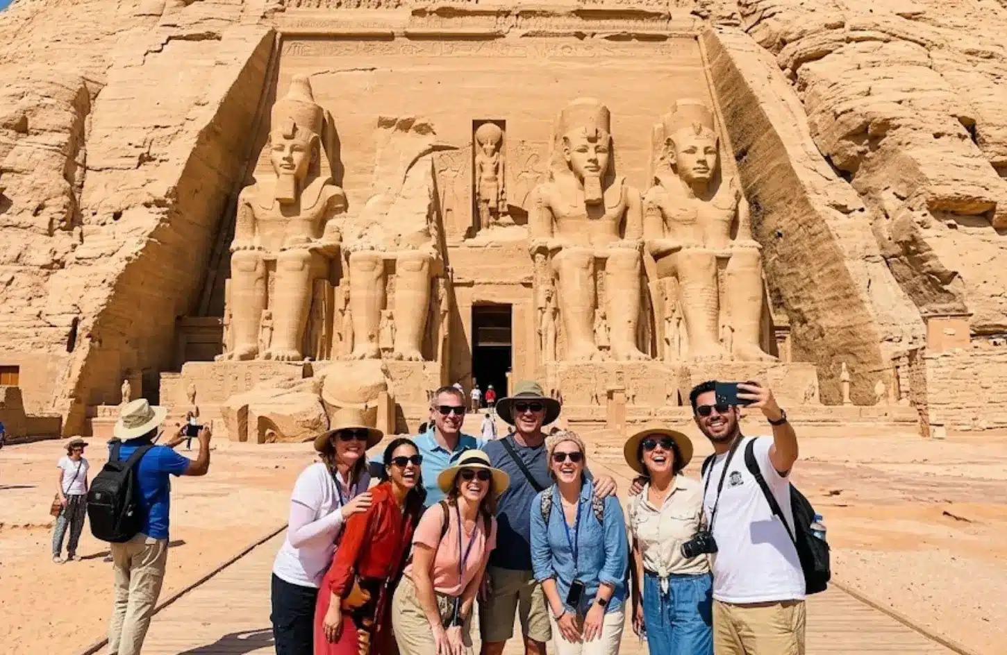 A stunning shot of a group of tourists in front of the Abu Simbel temple - Best Places to Visit in Egypt