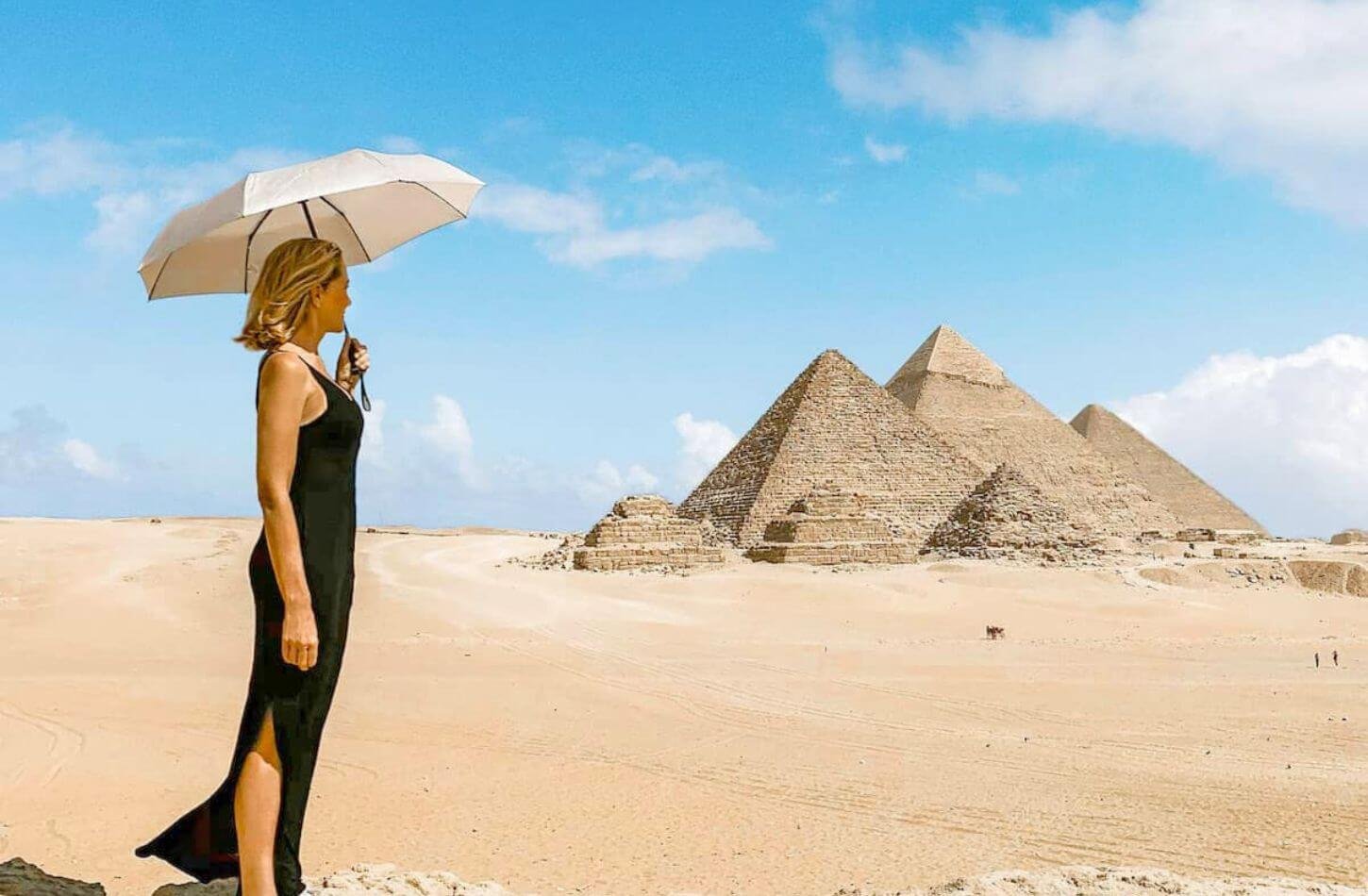 woman visiting giza pyramids egypt