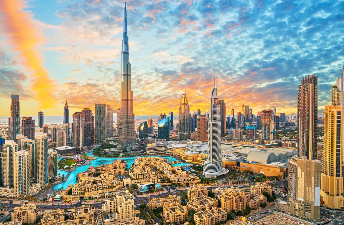 a stunning aerial view of downtown dubai and the burj khalifa at sunset was captured during the best time to visit dubai
