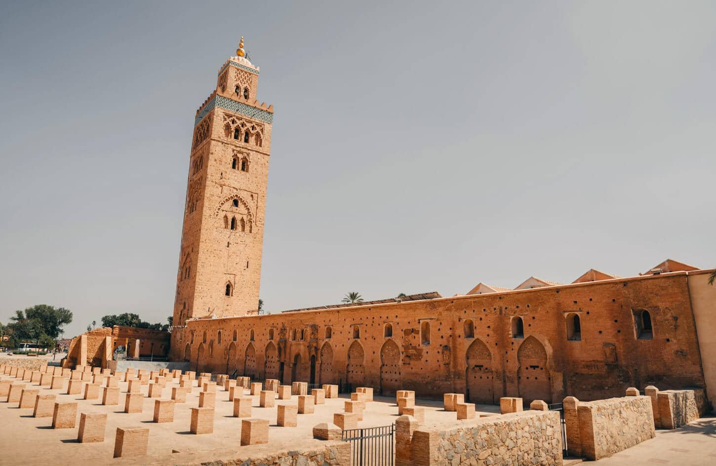 The iconic Koutoubia Mosque minaret and ancient ruins in Marrakech.