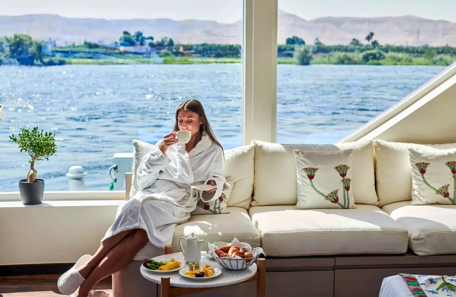 A wonderful picture of a tourist inside a cabin on board a cruise ship