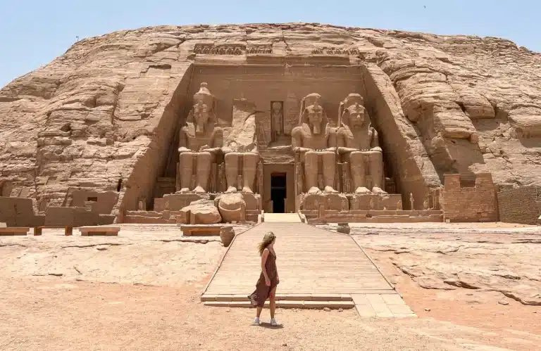 A stunning photo of a girl in front of the Abu Simbel temple - Solo Travel to Egypt