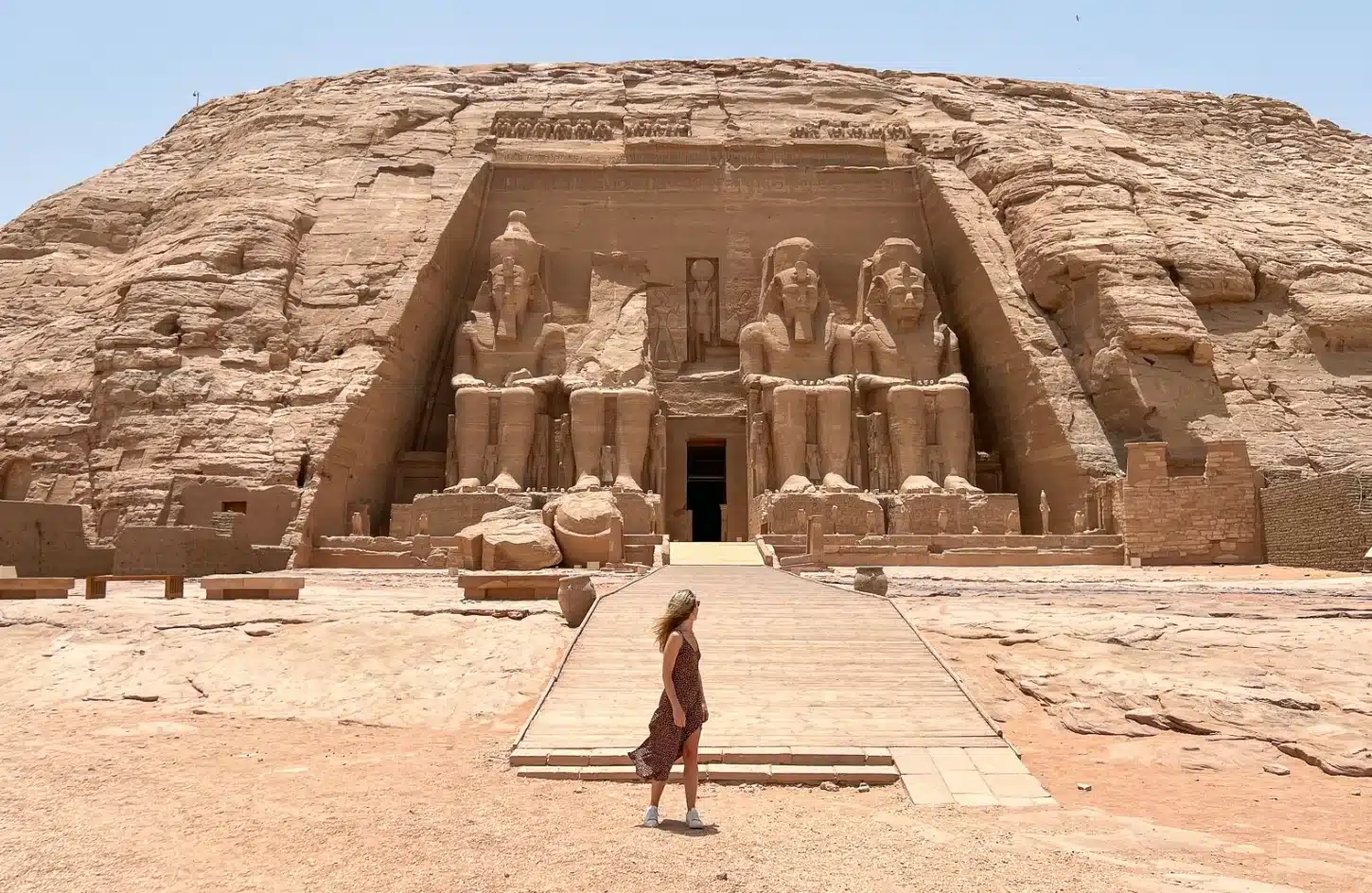 A stunning photo of a girl in front of the Abu Simbel temple - Solo Travel to Egypt
