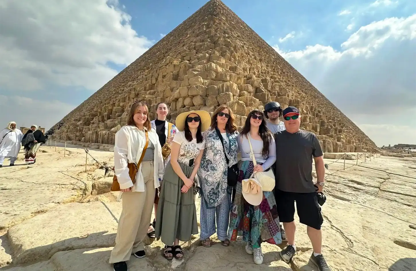 Group of tourists standing in front of the Great Pyramid of Giza during a guided tour in Egypt - Egypt Travel Advice