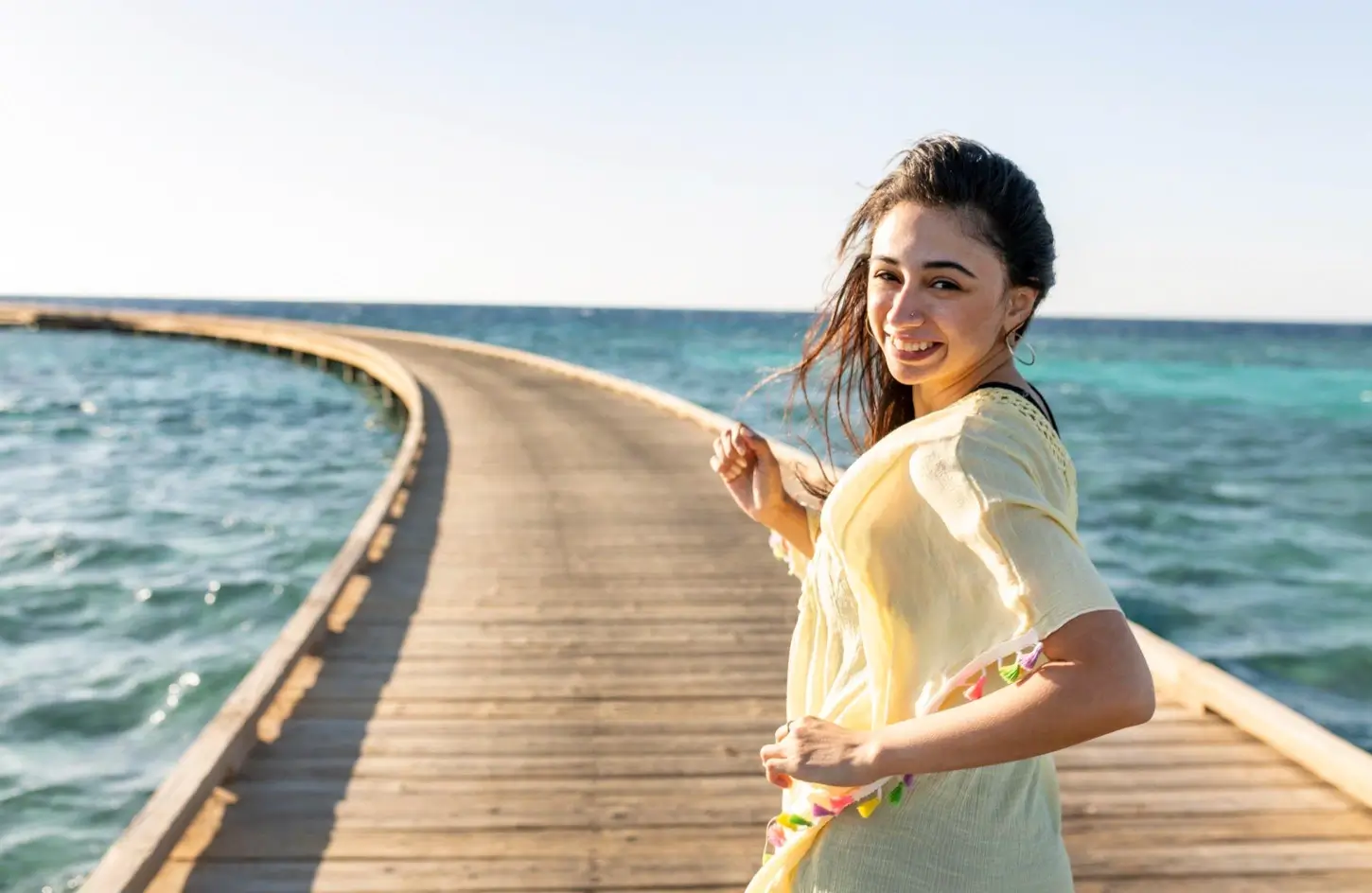 Female tourist walking on a wooden pier enjoying the Red Sea coast in Egypt - Egypt Travel Advice