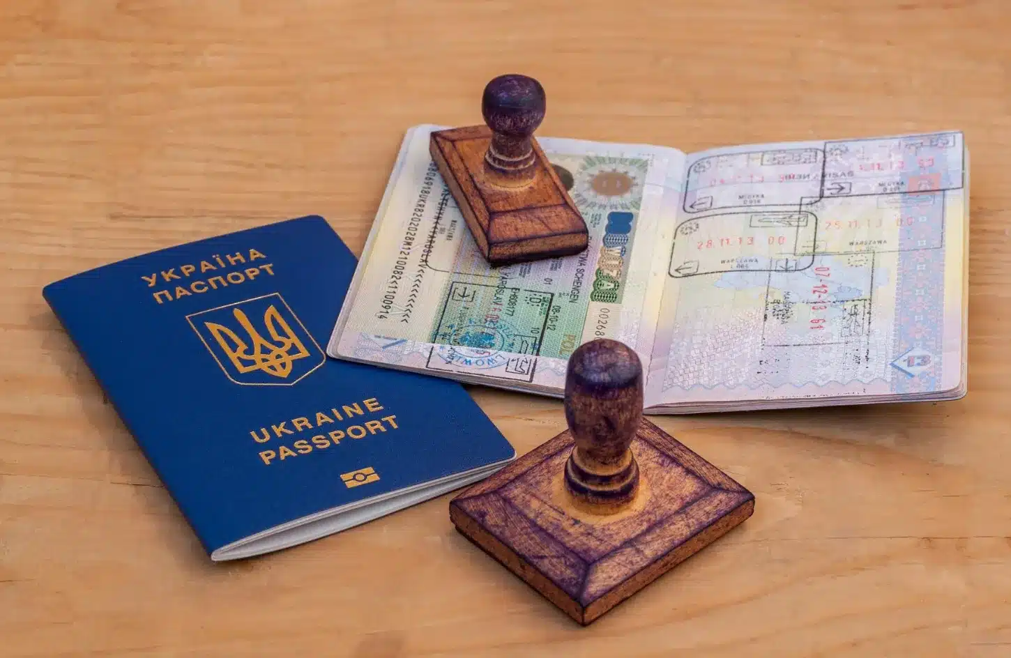 Passport standing open on a map with visa pages visible, representing international travel and entry visa requirements. - Egypt Visa Guide